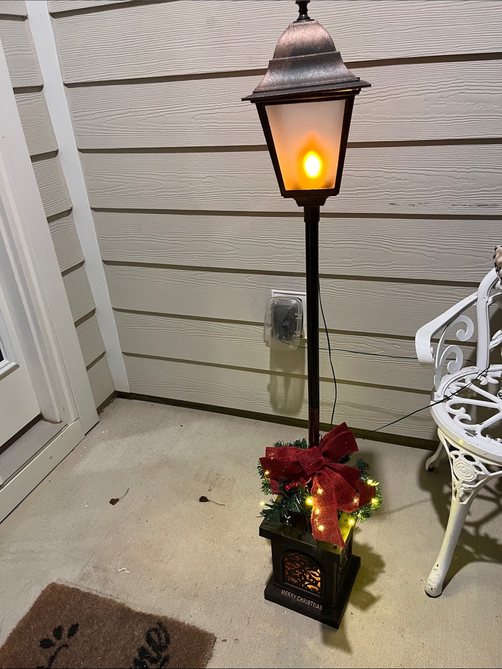 Holiday Time Black Outdoor Lantern with Red Bow and Warm Light 4 ft High